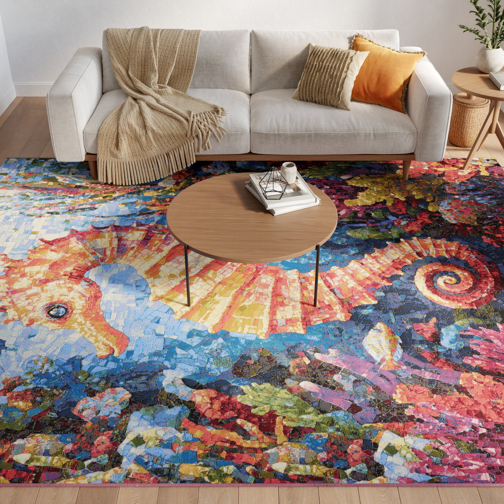 Round wooden coffee table atop a vivid colorful rug in a modern neutral living room with a beige sofa and mustard cushions.