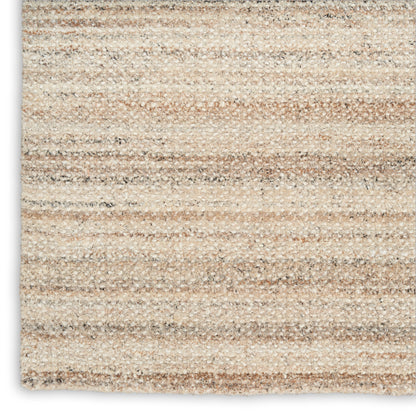 Beige striped area rug with textured loop pile in warm tan and cream tones; rectangular, modern living room decor.