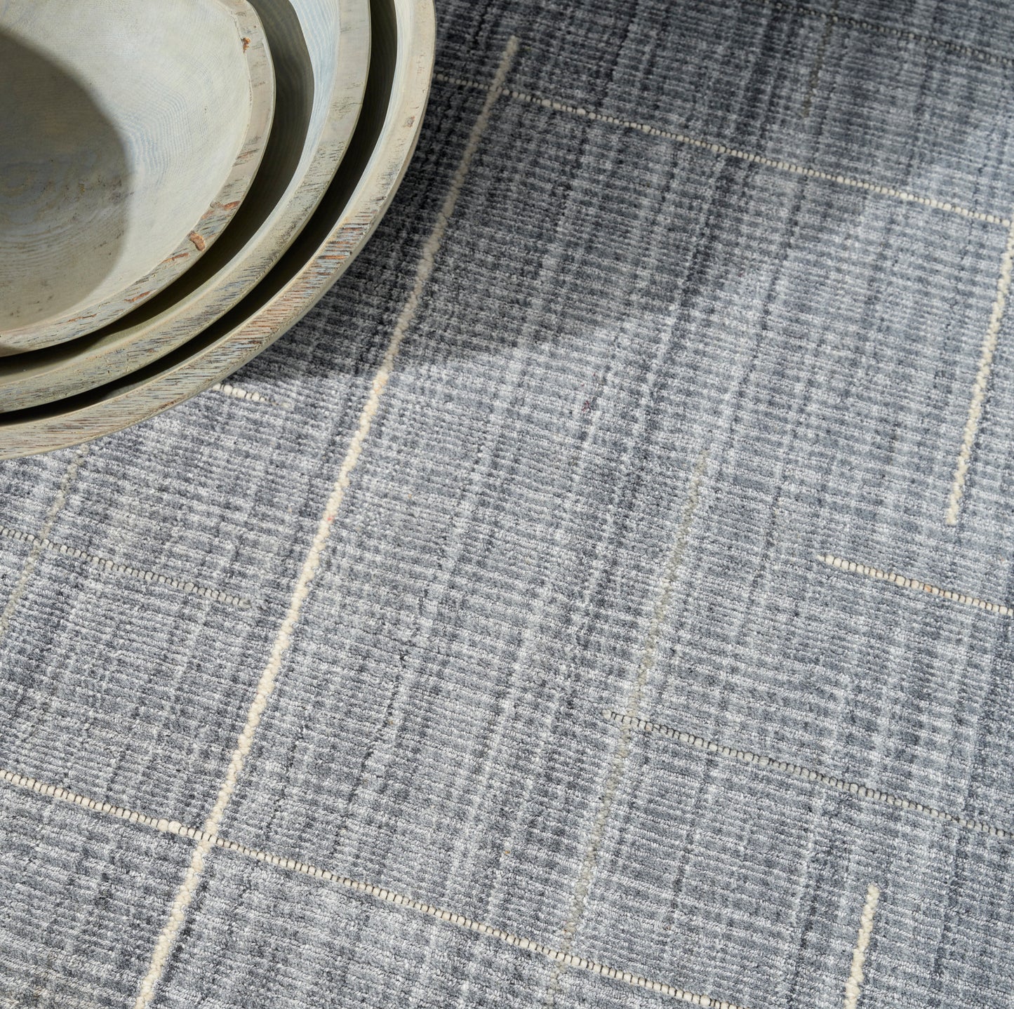 Blue-gray plaid rug.