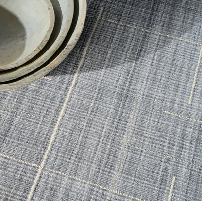Blue-gray plaid rug.