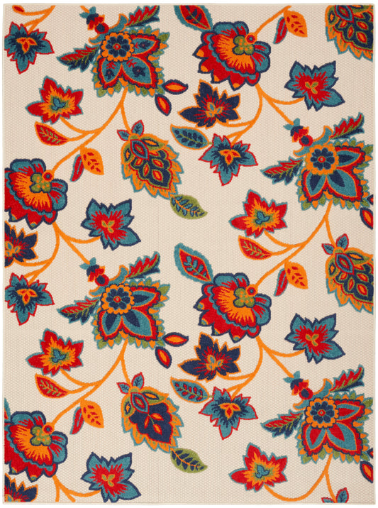 Cream rug with woven texture and vibrant multicolor floral pattern, orange stems & teal, blue, red blossoms.
