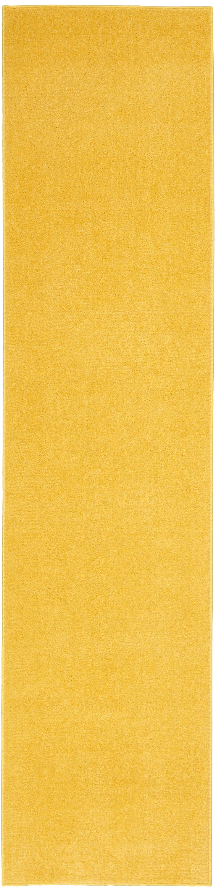 Golden yellow outdoor rug runner, long rectangular with bound edges.