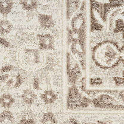Beige and taupe traditional rug with intricate border and floral motifs; plush woven texture.