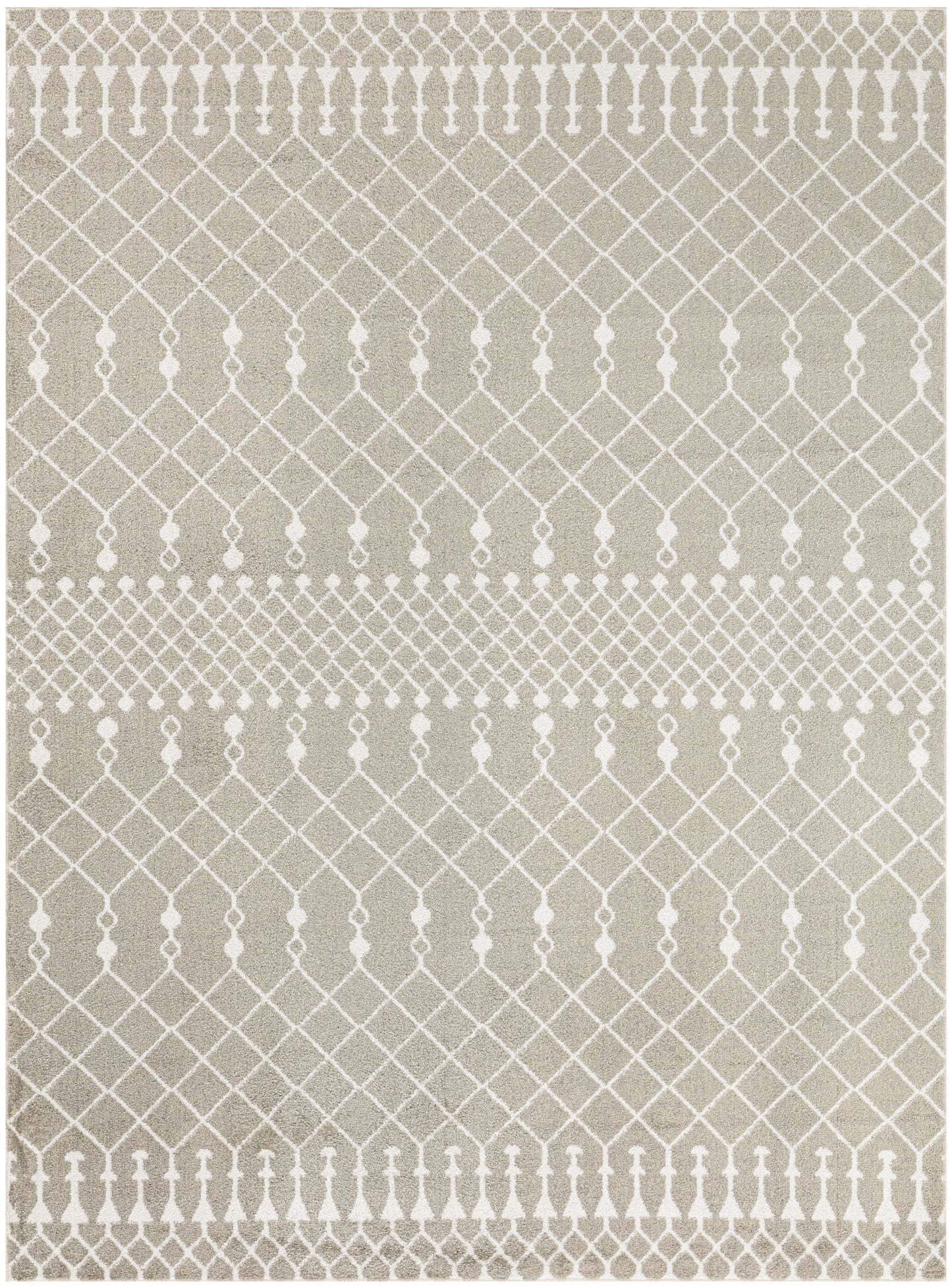 Beige rug with white diamond lattice and vertical dot motif bands; modern geometric, neutral living room decor.