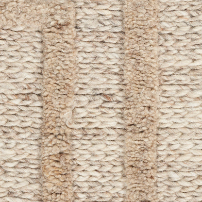Beige and cream boucle knit fabric with chunky textured stripes, cozy throw blanket material.