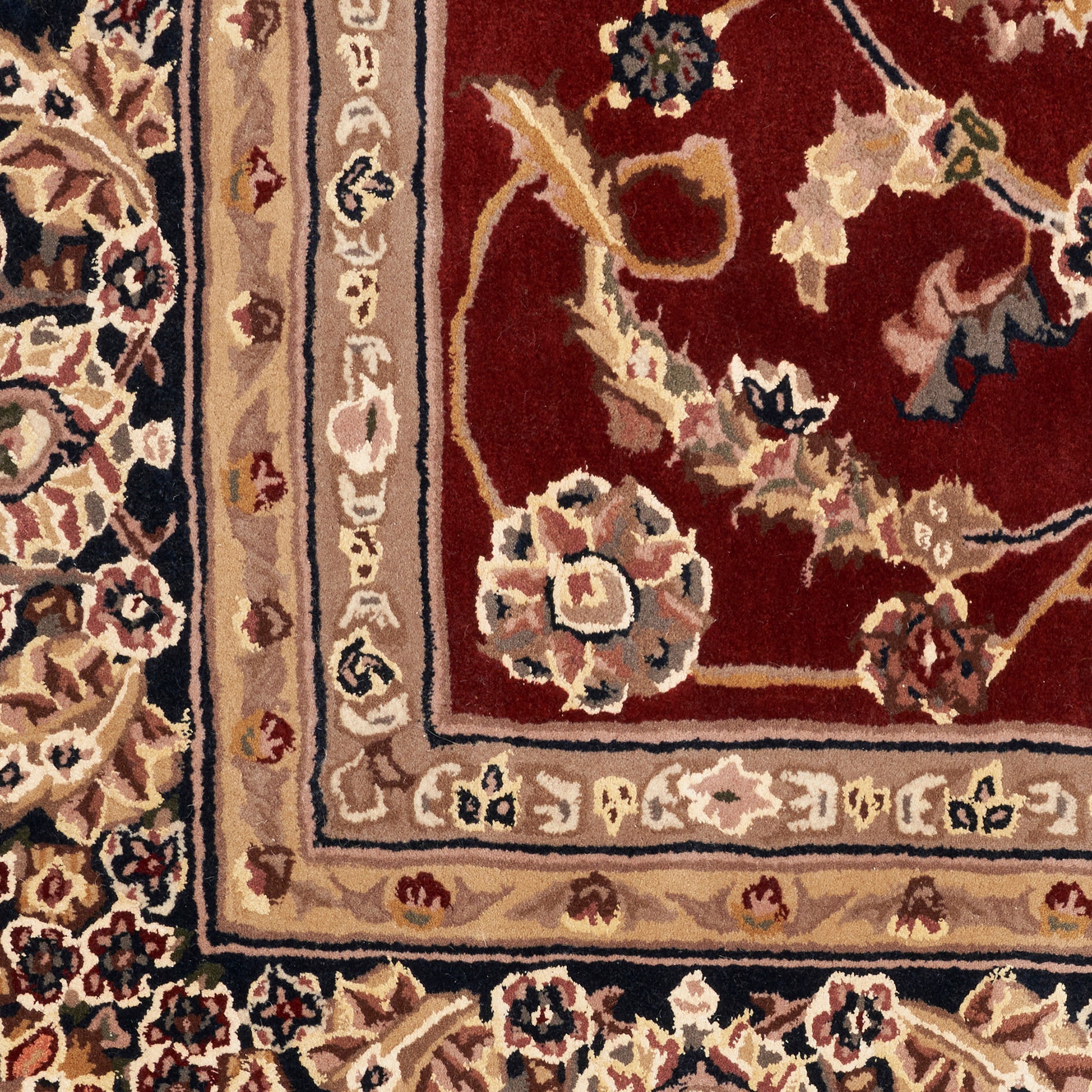 Traditional Persian-style rug with deep red field, beige borders and ivory floral motifs.