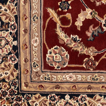 Traditional Persian-style rug with deep red field, beige borders and ivory floral motifs.