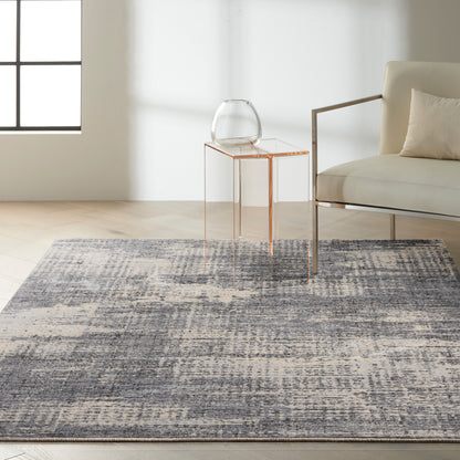 Blue-gray textured area rug in a modern living room.