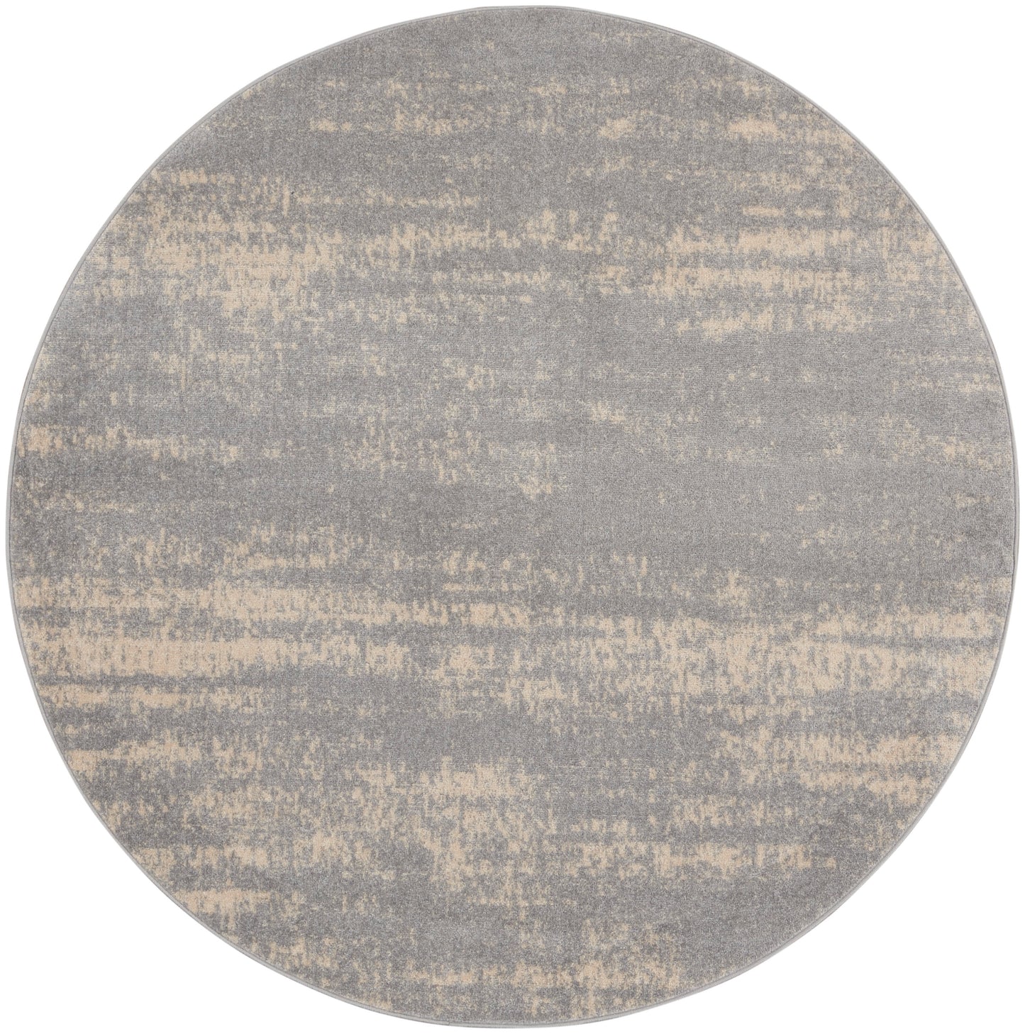 6 ft round rug with a muted gray and beige speckled pattern and soft textured surface.