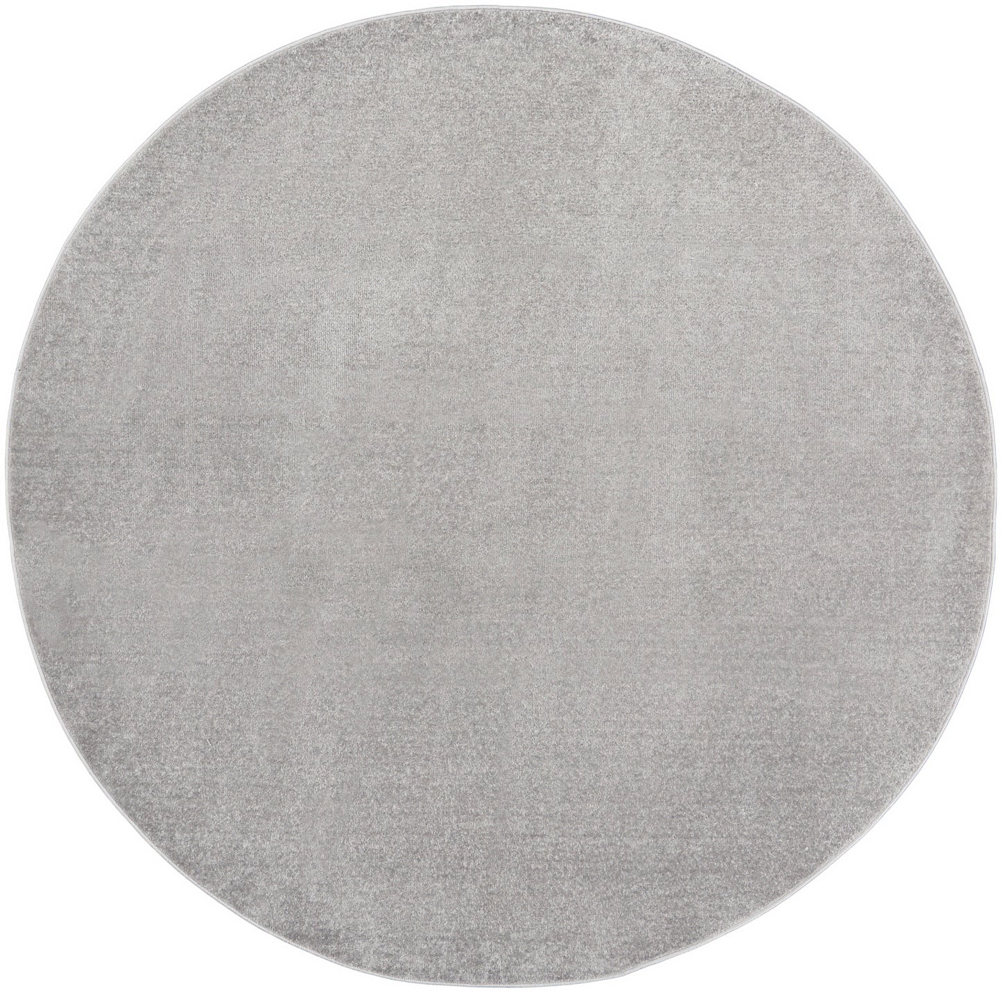 Light gray round outdoor rug with soft texture & modern minimalist style; 6' diameter.