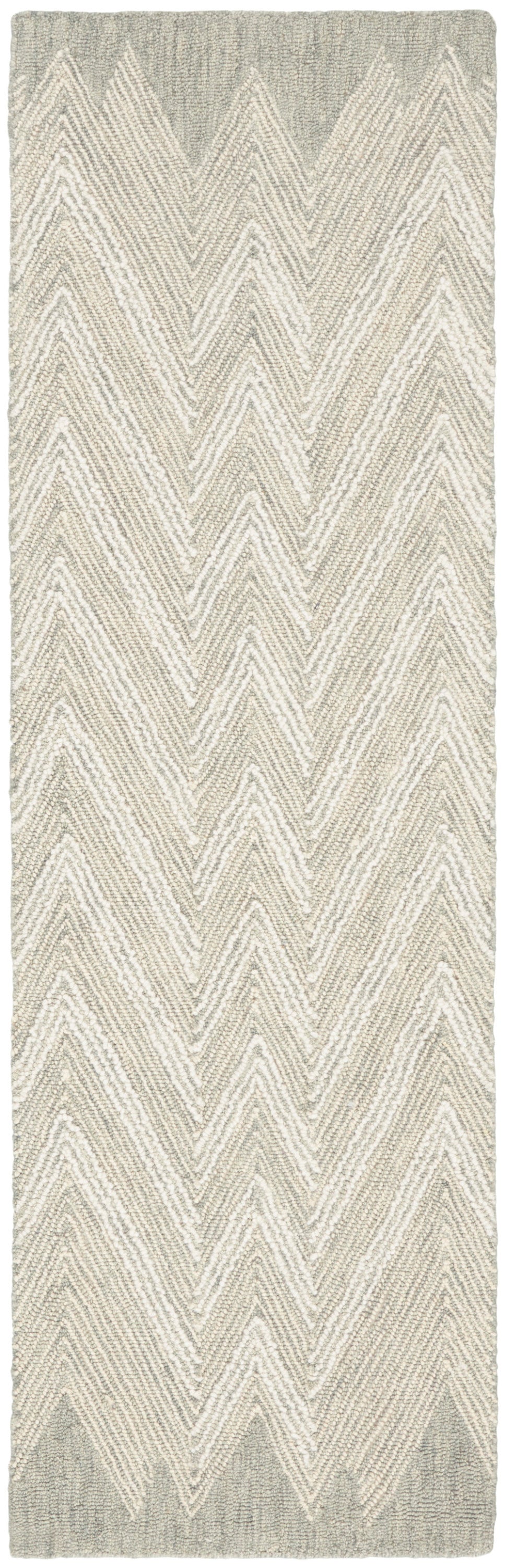 Beige and gray chevron rug runner with textured boucle weave; neutral hallway or living room decor.