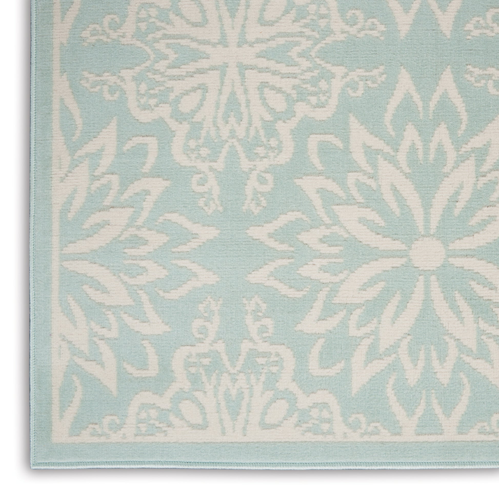 Light blue damask rug with white floral medallion pattern and pale blue border, 4' x 6'.