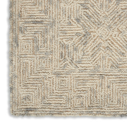 Beige and gray geometric tufted shag rug; rectangular plush pile with maze-like patterns.