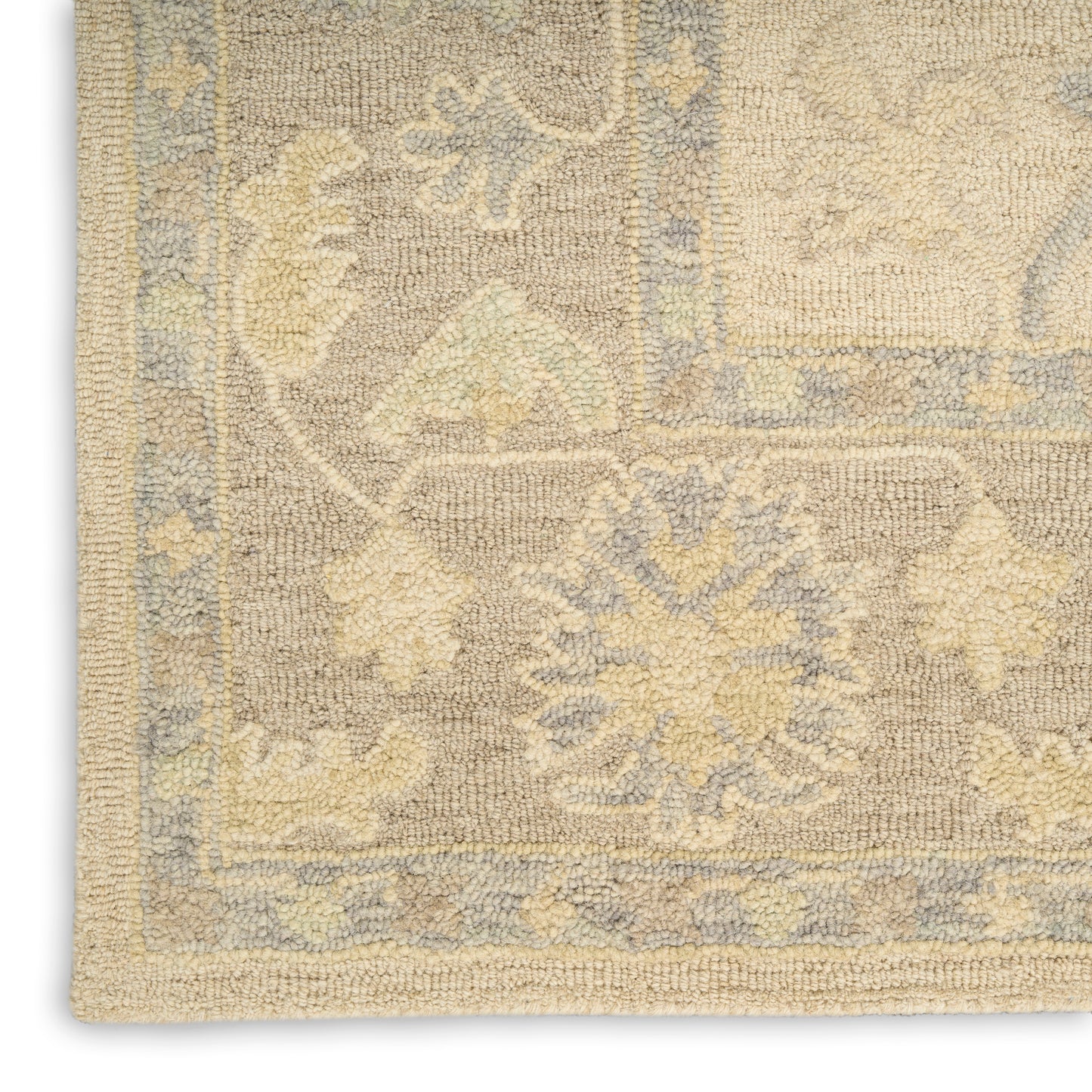 Beige and pale blue traditional rectangular rug with floral medallions and blue border; soft woven pile.
