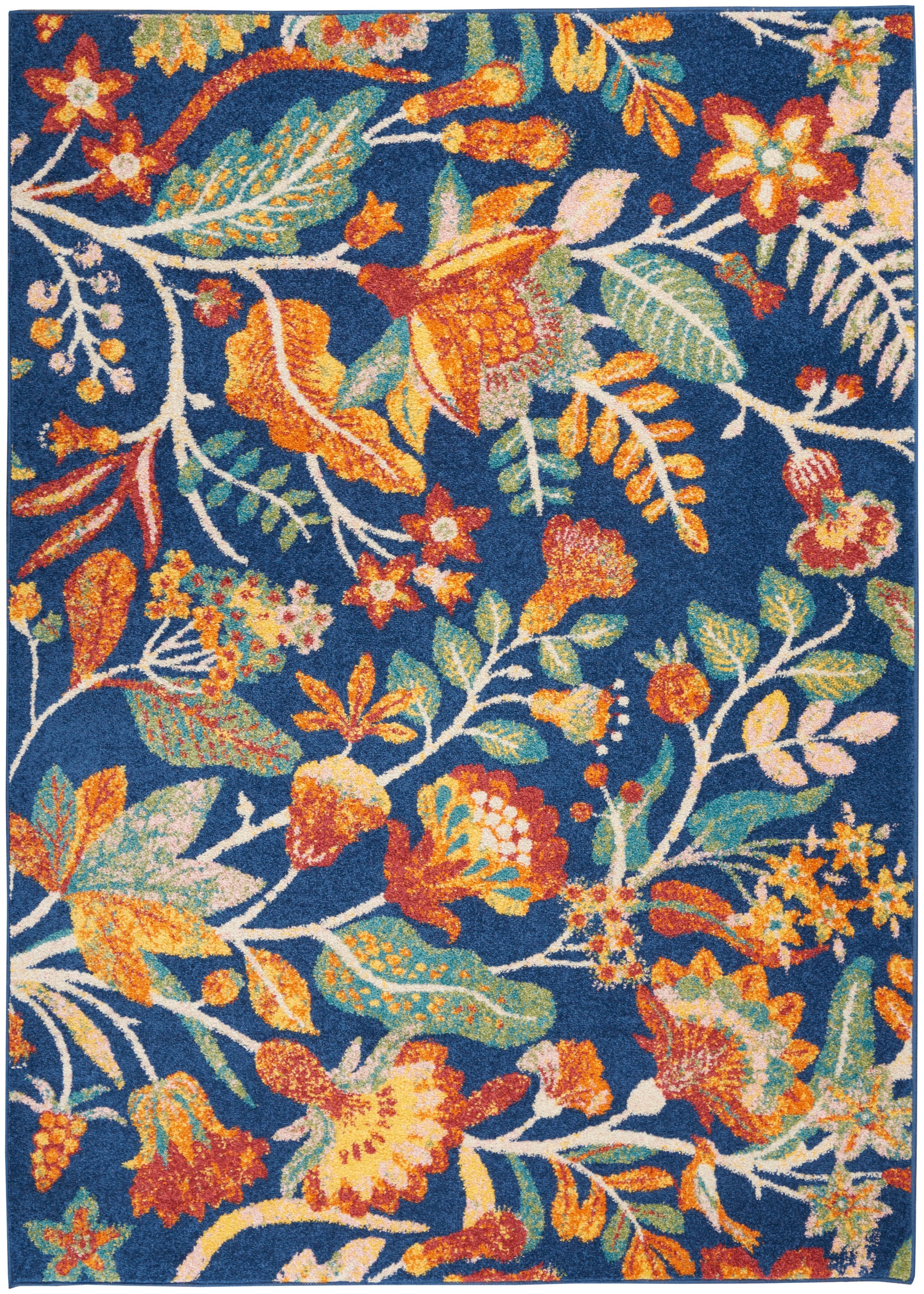 Dense floral rug with vibrant orange, yellow, and green blossoms on a navy blue background.