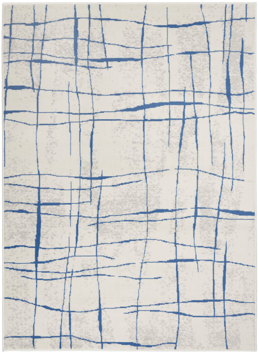 Rectangular cream rug with bold blue irregular grid lines for a modern abstract look