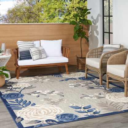 Blue-beige floral outdoor rug, 5' x 8'.