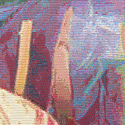 Close-up of a colorful sequined textile with pinks, purples, blues and yellows forming abstract geometric patterns.