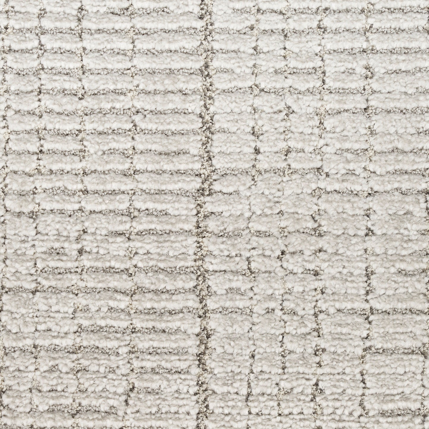 Cream textured rug with subtle grid pattern & looped pile.