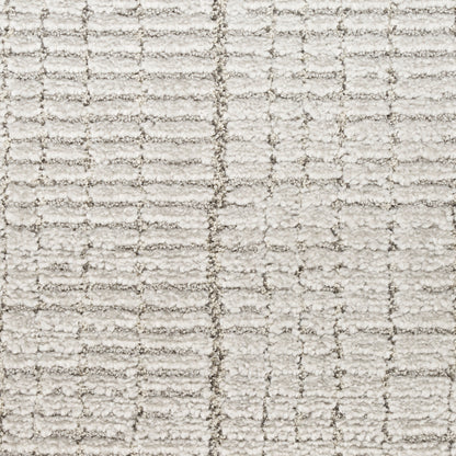 Cream textured rug with subtle grid pattern & looped pile.