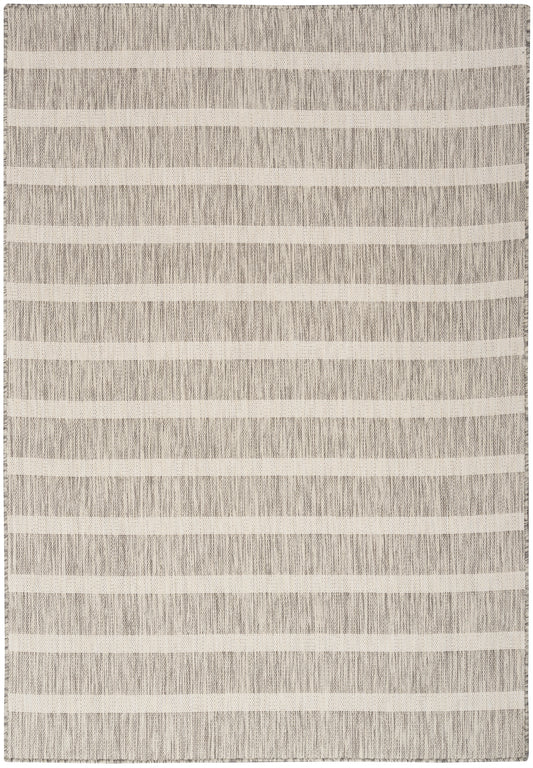 Beige and gray striped rug with a textured weave; rectangular, modern living-room decor.