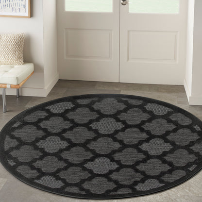 Round black-and-charcoal trellis-patterned rug for entryway or foyer; geometric lattice motif.