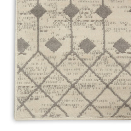 Beige flat-woven rug with a gray diamond lattice pattern and fringed edge.