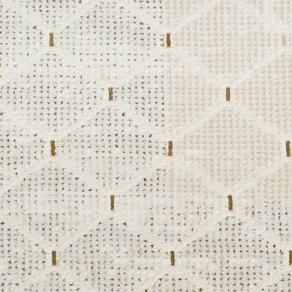Cream woven fabric with diamond lattice pattern, beige texture and small brown dashes; upholstery or rug material.