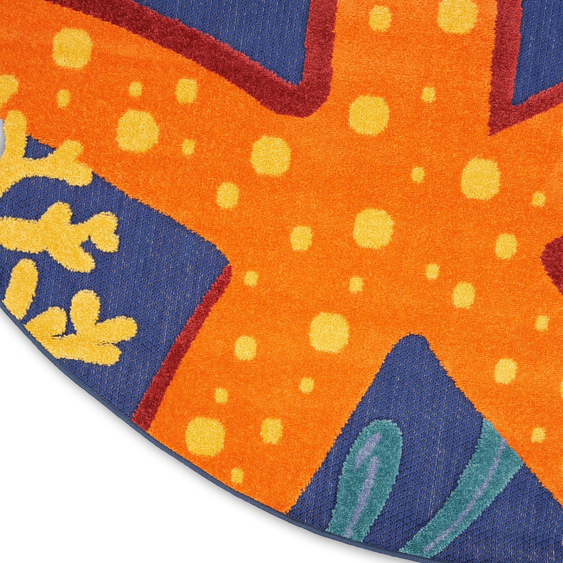 Textured orange and blue abstract outdoor round rug with yellow dots, teal leaf shapes, and purple-red outlines.