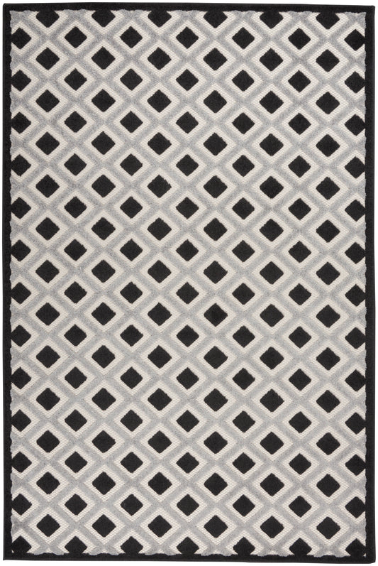 Gray area rug with a repeating lattice of black diamonds on a light gray background and a solid black border.