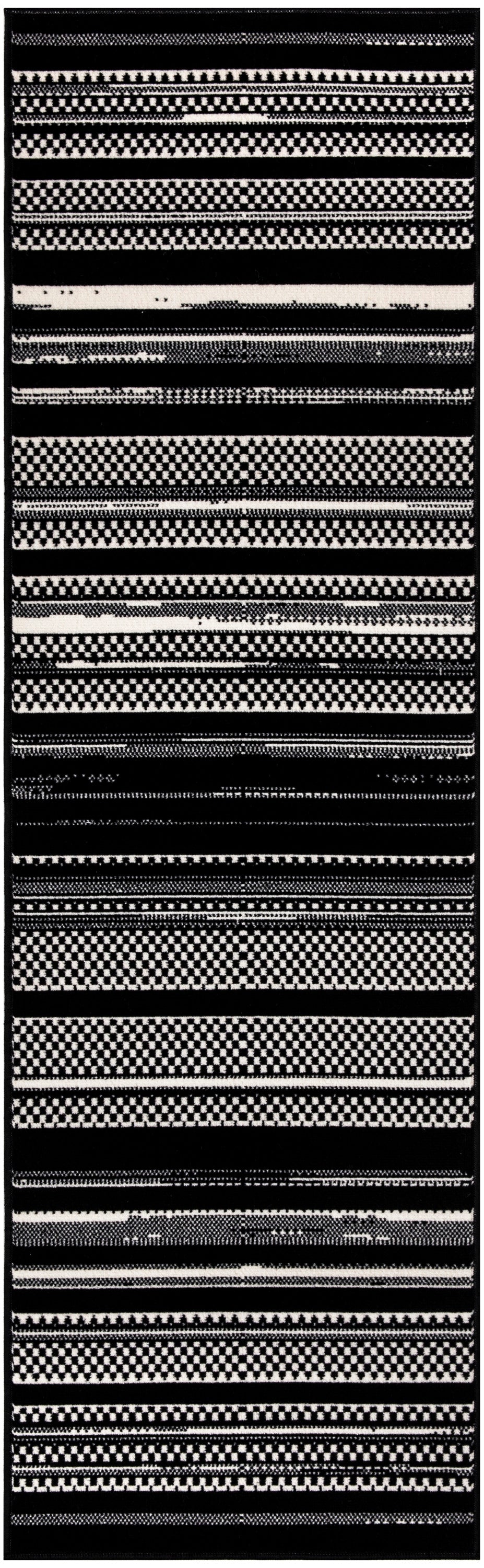 Black and white striped rug runner with geometric checker patterns and bold horizontal bands, modern tribal style.