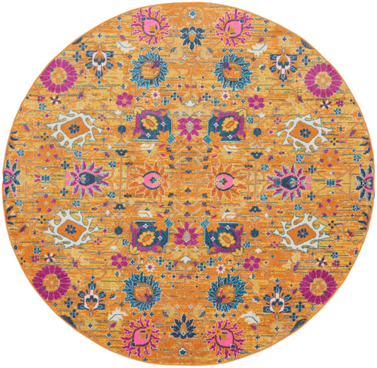 Round orange rug with vibrant multicolor floral pattern in pink, blue, purple and white.