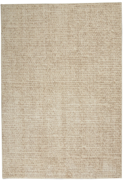 Beige rectangular rug with soft, textured surface and neutral tan tones.