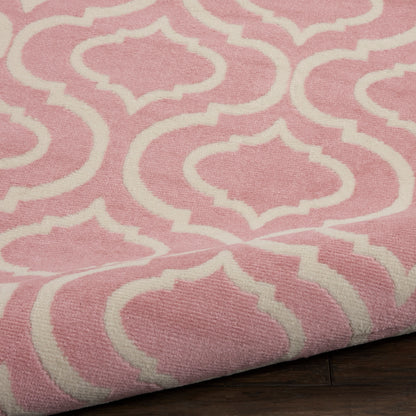Pink rug with white trellis lattice pattern, woven texture, folded corner on dark wood floor.