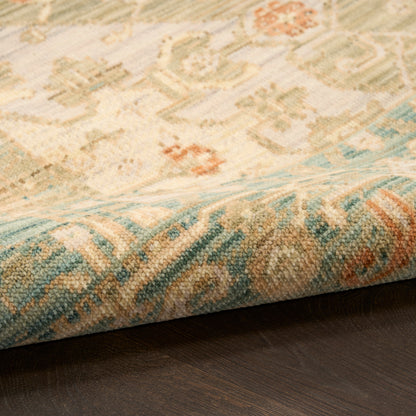 Soft woven runner rug with cream, teal, and terracotta geometric pattern; rolled edge on dark wood floor; 12' length.