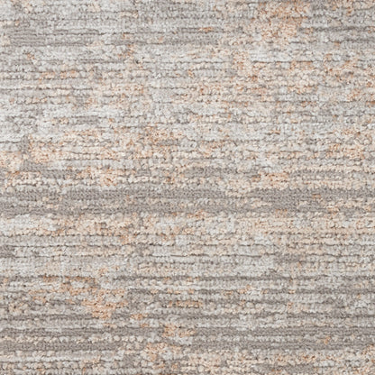 Neutral gray and beige shag rug with soft, textured pile and subtle stripe pattern.