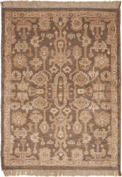 Rectangular oriental-style rug in beige, taupe and caramel with an intricate medallion and floral pattern, fringed ends.