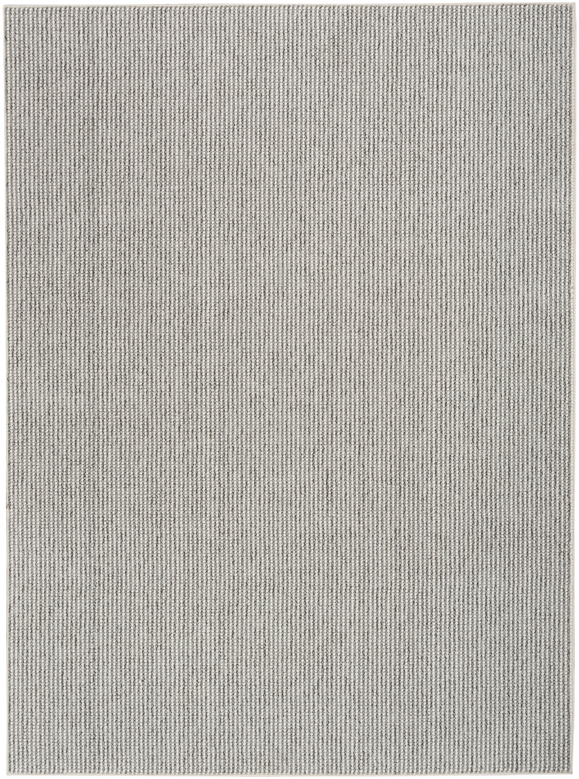 Light gray flat-weave rug with subtle vertical stripe texture; rectangular, farmhouse decor.