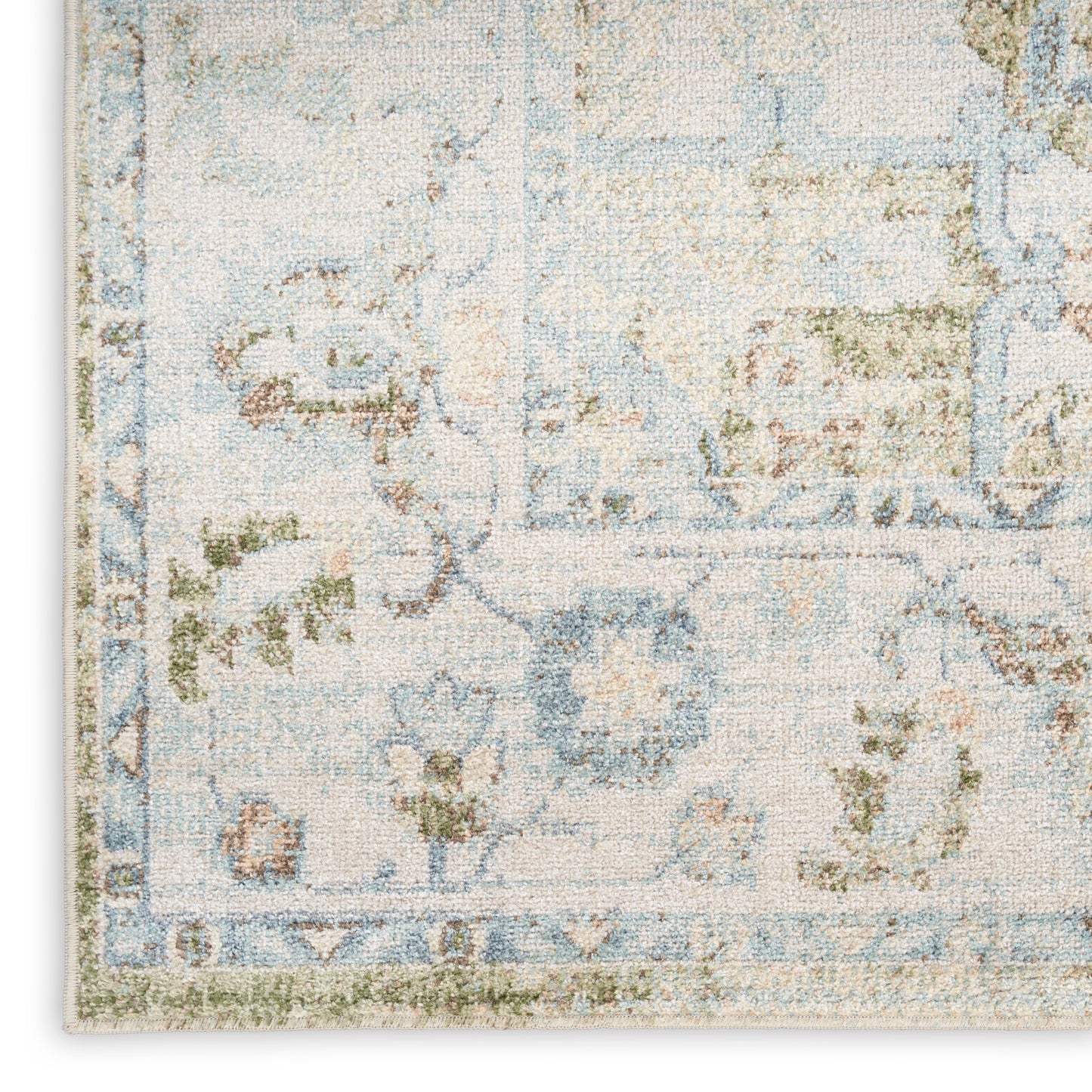 Blue and ivory distressed floral area rug with vintage border, oriental-style.
