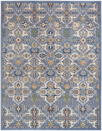 Rectangular blue rug with ornate Persian-style floral pattern in ivory, beige, green and orange and a decorative border.