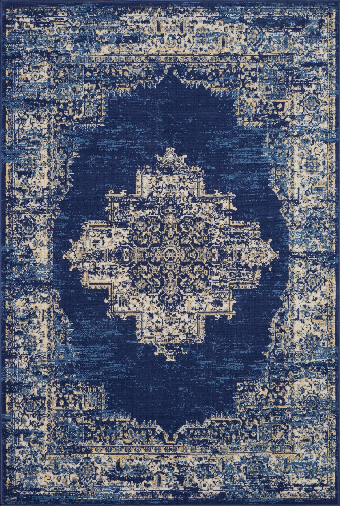 Distressed navy blue Persian-style area rug with beige antique medallion motif.