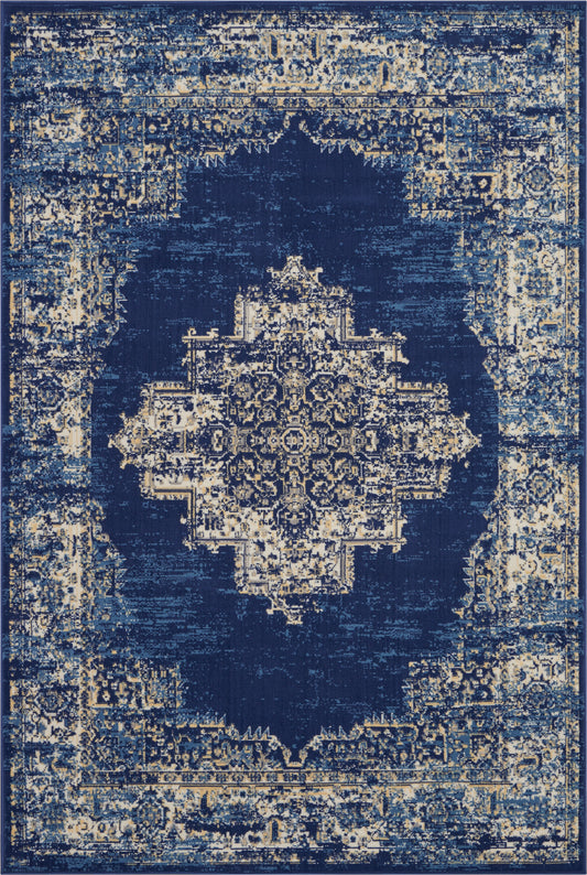 Distressed navy blue Persian-style area rug with beige antique medallion motif.