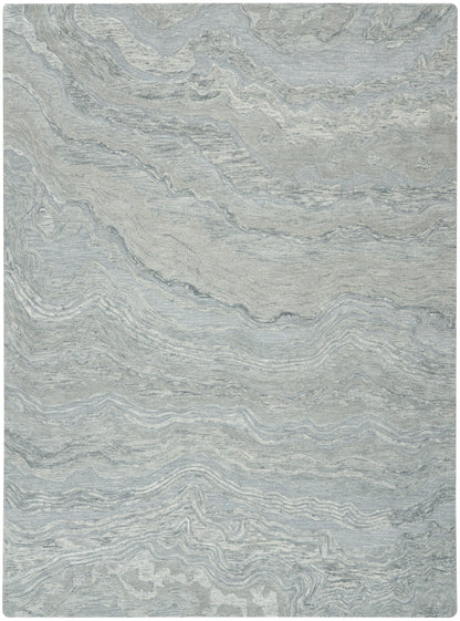 Rectangular light gray-blue area rug with marbled, wavy pattern and subtle texture; modern, versatile decor piece.