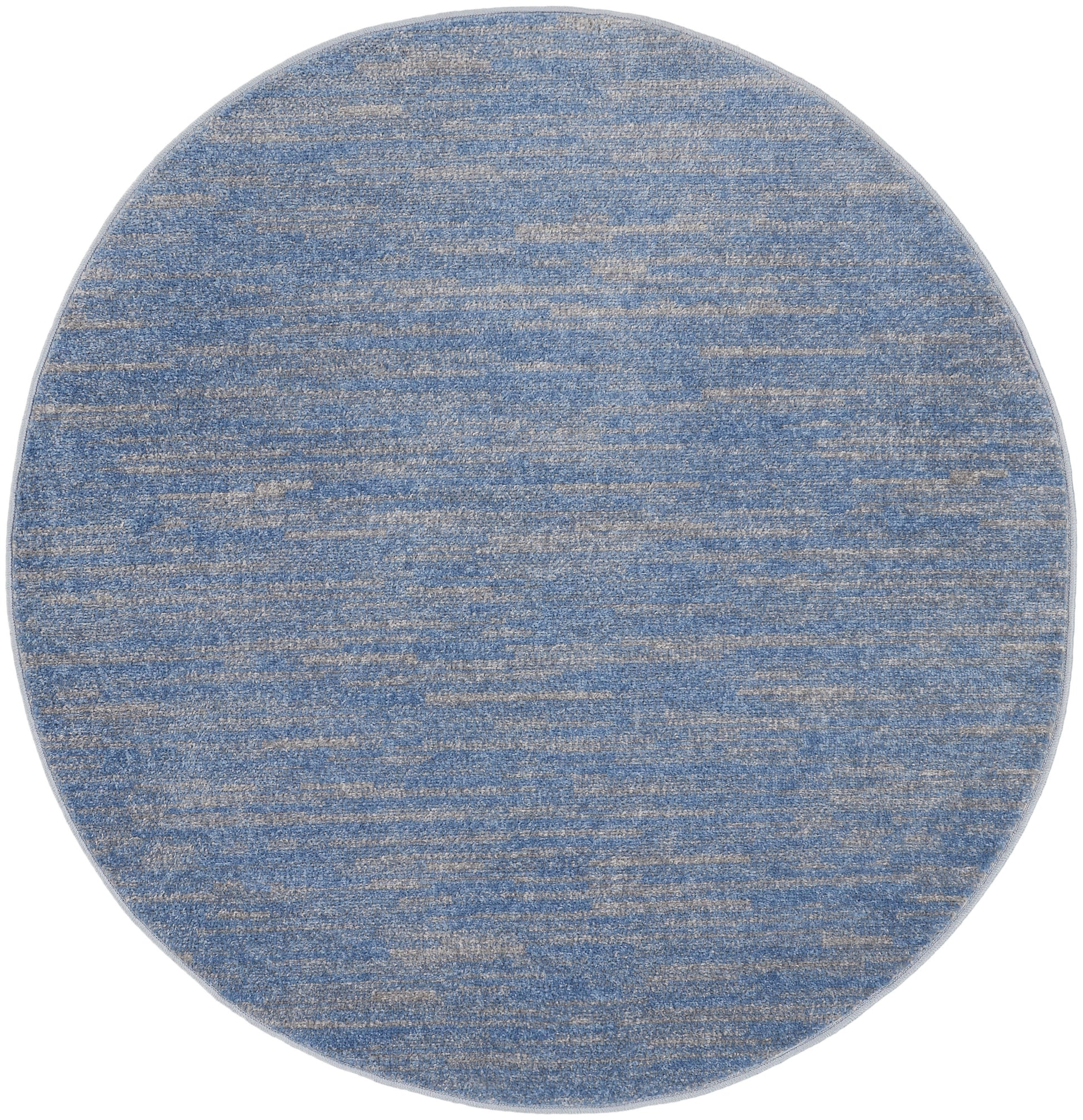 Round blue heathered rug with beige flecks; soft woven texture for living spaces.
