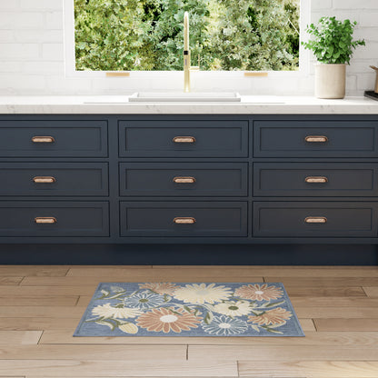 Navy blue floral outdoor rug on wood floor, 3' x 4'.