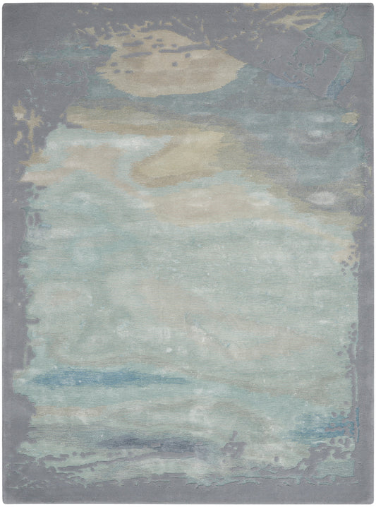 Abstract pastel area rug in blues, grays, and beige with a watercolor-like pattern and soft gray border.
