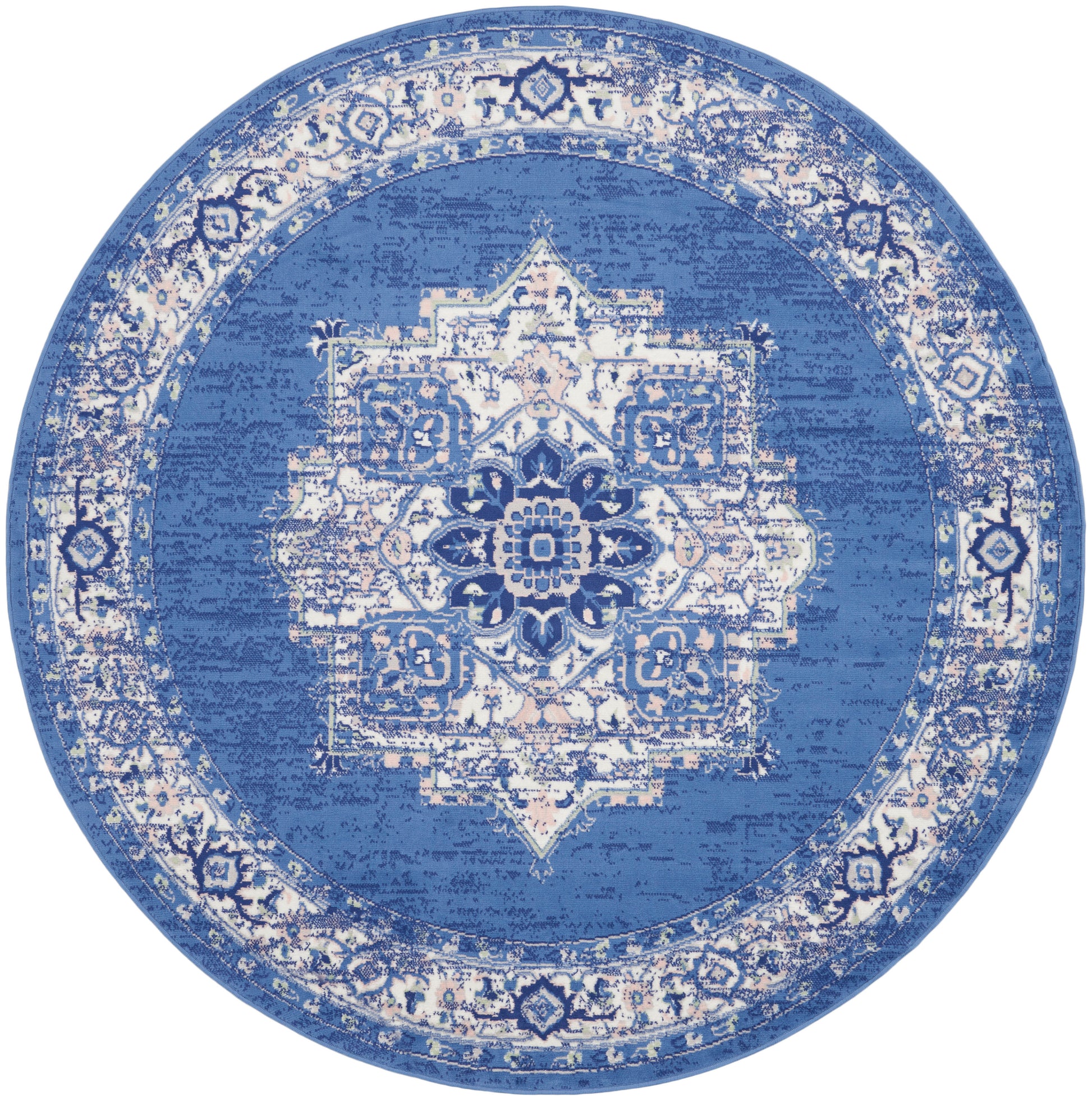 Round blue rug with a distressed white oriental medallion and ornate border.