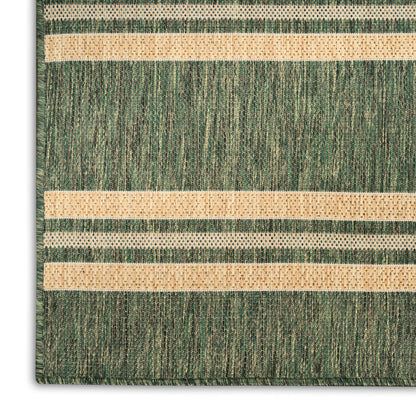 Green woven rug with beige dotted horizontal stripes, textured surface and visible corner.