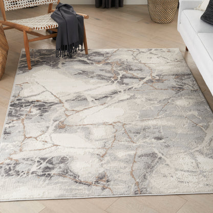 Rectangular light gray marble-pattern area rug with beige and charcoal veining in a contemporary living room