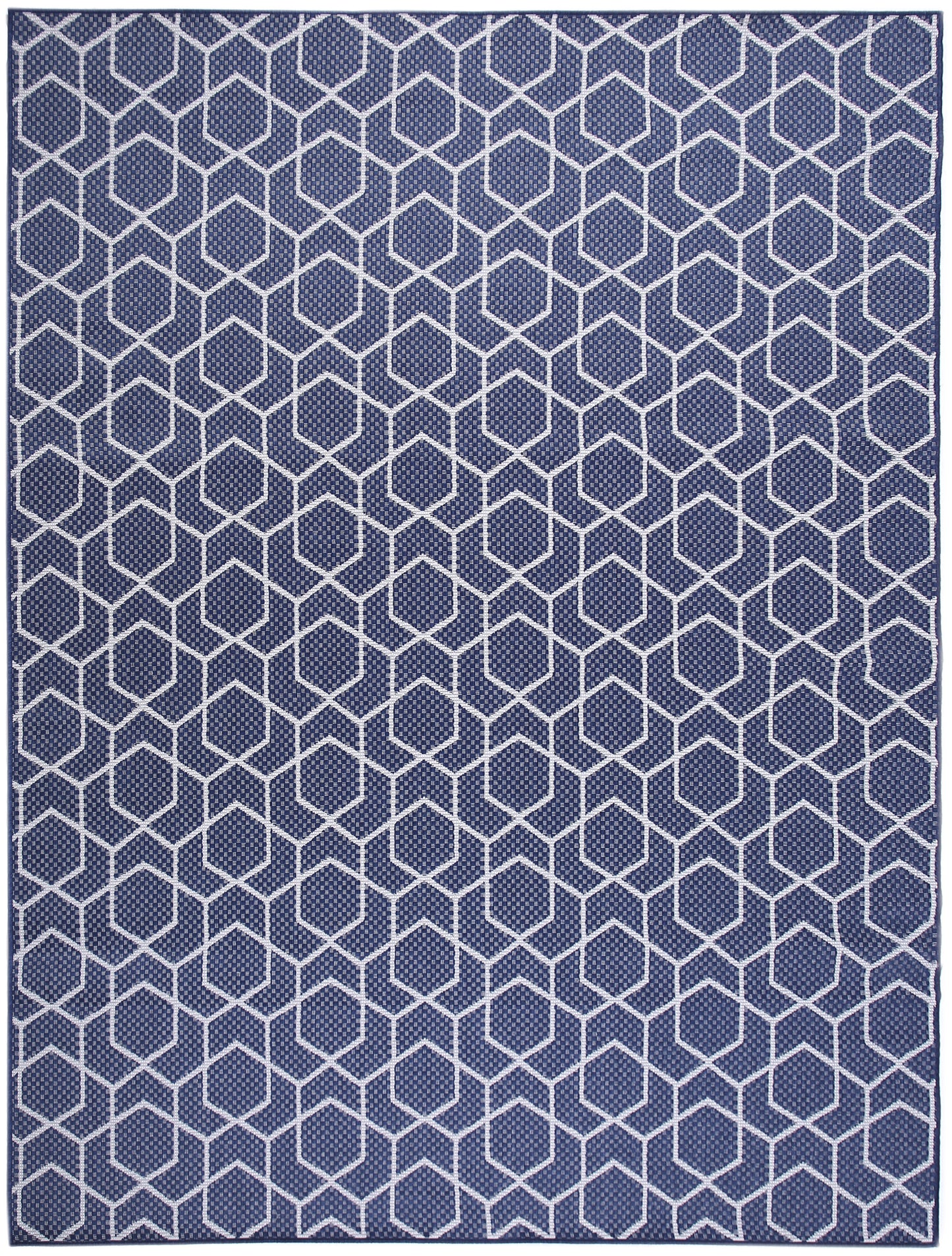 Navy blue rug with white hexagon lattice geometric pattern.